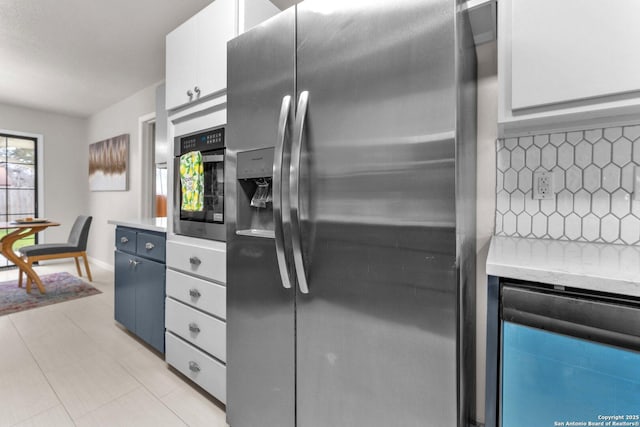 kitchen featuring stainless steel appliances, wine cooler, light countertops, and white cabinetry