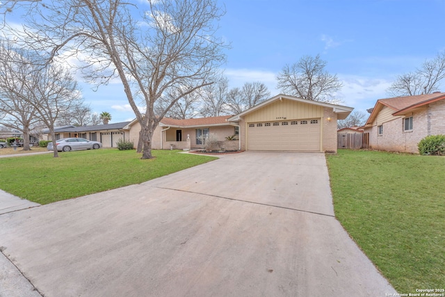 ranch-style house featuring a garage, concrete driveway, brick siding, and a front yard