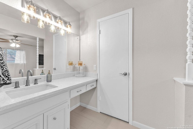 bathroom featuring ceiling fan, tile patterned floors, vanity, and baseboards