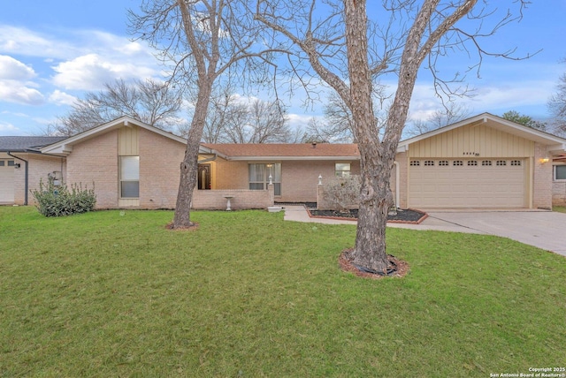 single story home featuring a garage, concrete driveway, brick siding, and a front lawn