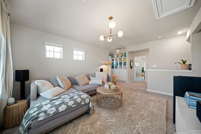 living area featuring light carpet and baseboards