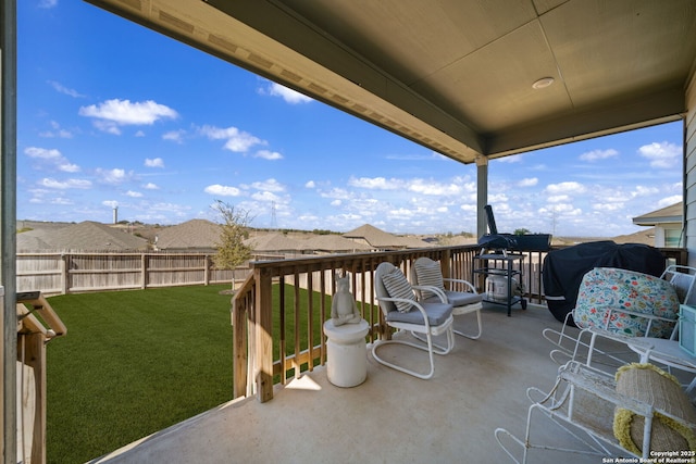 view of patio / terrace with a fenced backyard and a residential view