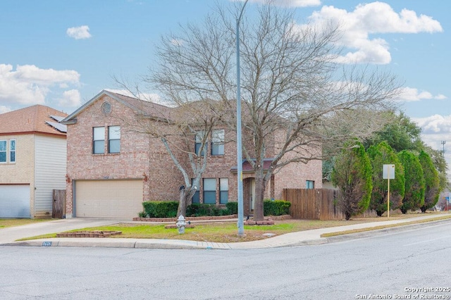 view of front facade featuring concrete driveway, brick siding, fence, and an attached garage