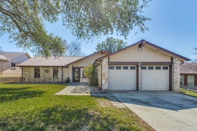 view of front facade featuring a garage, driveway, stone siding, and a front yard