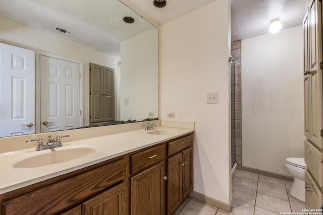 full bathroom with tile patterned flooring, visible vents, a sink, and toilet