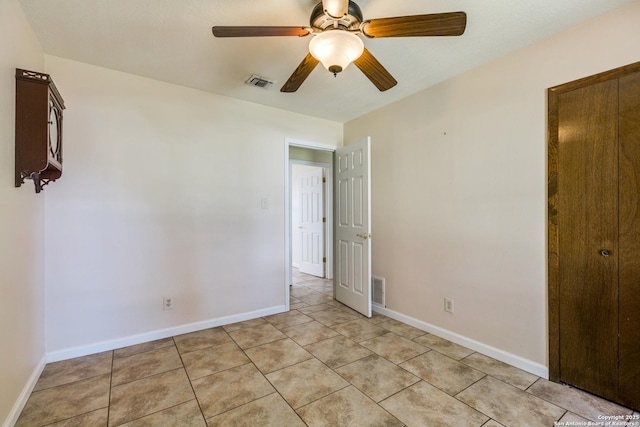 unfurnished bedroom with baseboards and visible vents