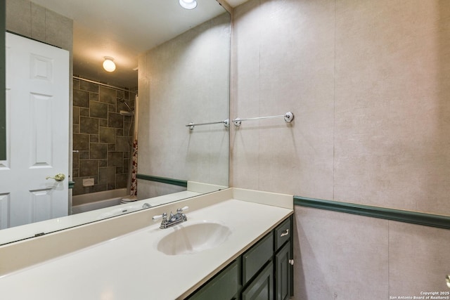 bathroom featuring a shower and vanity