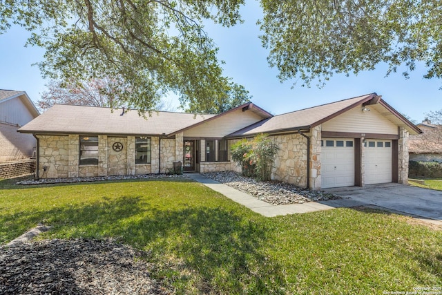 ranch-style home with a garage, a front yard, concrete driveway, and stone siding