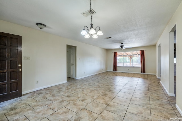 empty room with light tile patterned flooring, visible vents, and baseboards