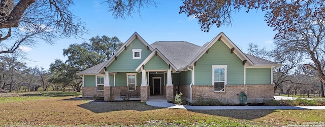 view of front of property with brick siding and a front lawn