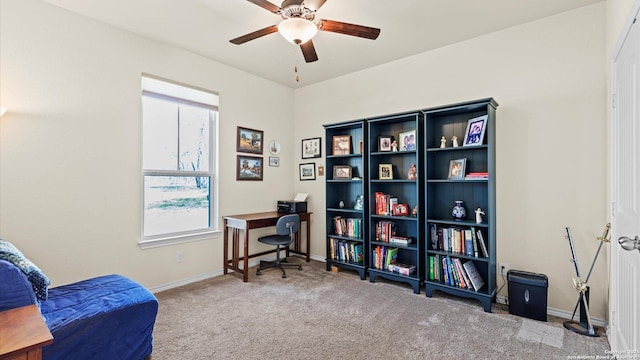 sitting room featuring carpet floors, a wealth of natural light, baseboards, and a ceiling fan