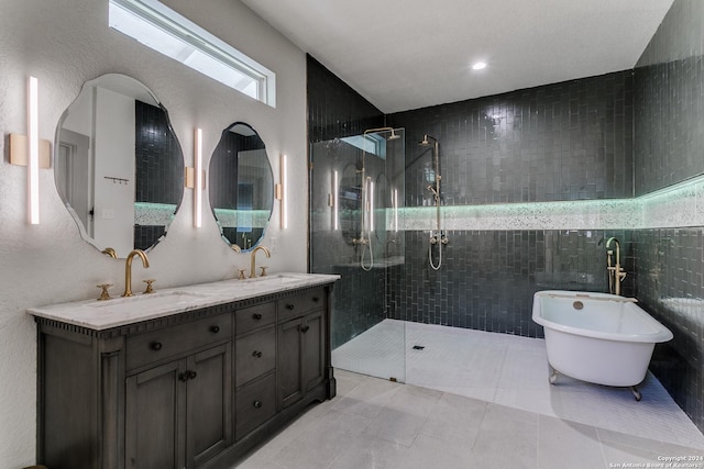 full bath with a stall shower, a soaking tub, a sink, and double vanity