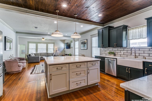 kitchen with a sink, open floor plan, a center island, dishwasher, and decorative light fixtures