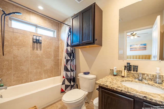 bathroom featuring shower / bath combo, toilet, ceiling fan, tile patterned flooring, and vanity