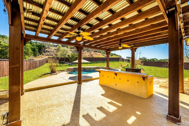 view of patio / terrace with a fenced backyard, a ceiling fan, and a fenced in pool