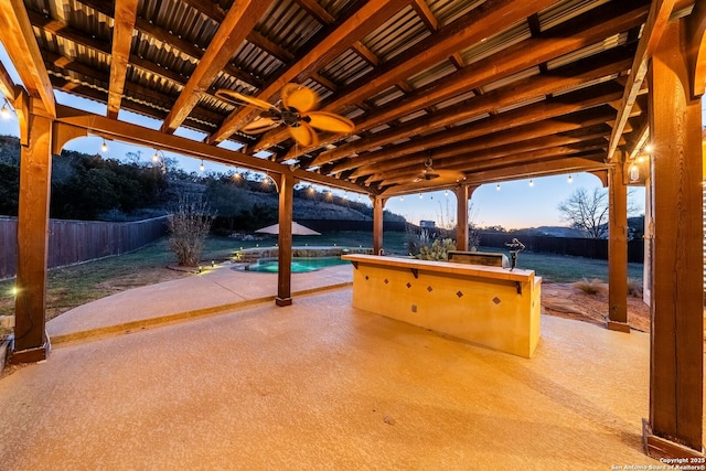 view of patio / terrace featuring a water view, an outdoor pool, and a fenced backyard