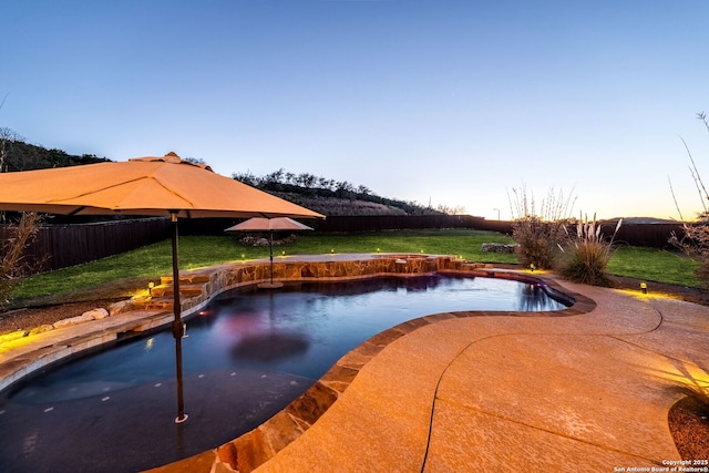 view of pool featuring a lawn, a patio area, a fenced backyard, and a fenced in pool