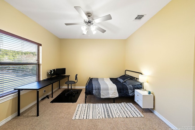 bedroom with visible vents, ceiling fan, light carpet, and baseboards