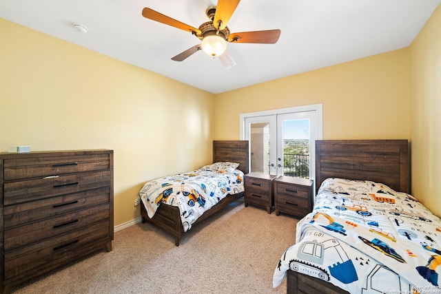 bedroom featuring access to exterior, ceiling fan, french doors, and light colored carpet