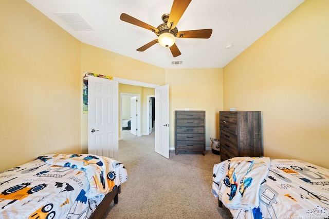 carpeted bedroom with ceiling fan, visible vents, and baseboards