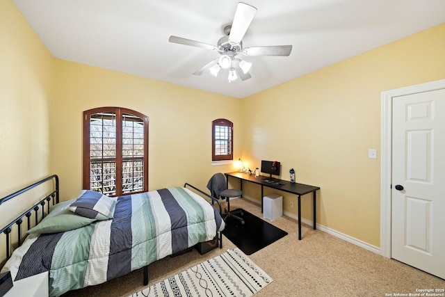 bedroom with carpet flooring, ceiling fan, and baseboards