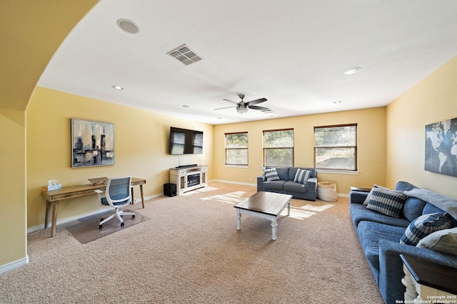 carpeted living area with baseboards, visible vents, ceiling fan, and recessed lighting