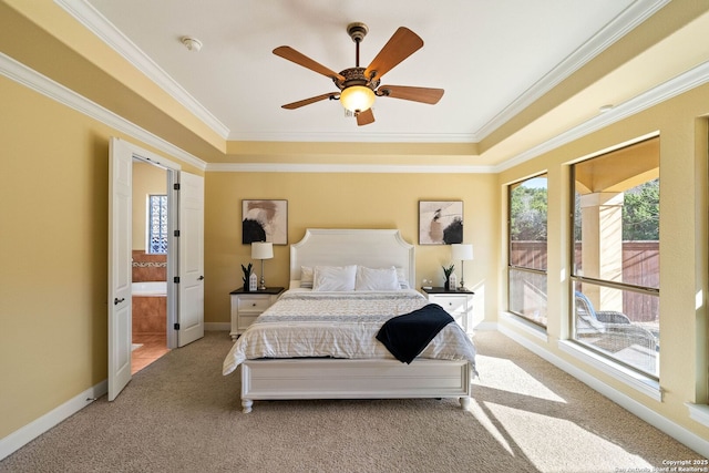 bedroom featuring ensuite bath, baseboards, ornamental molding, and light colored carpet