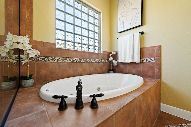 bathroom with a whirlpool tub