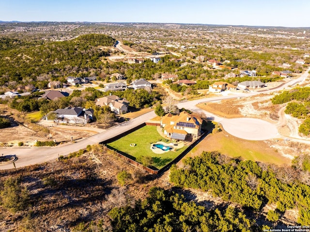 birds eye view of property with a residential view