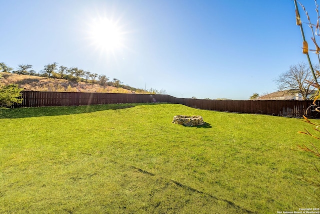 view of yard with a fenced backyard