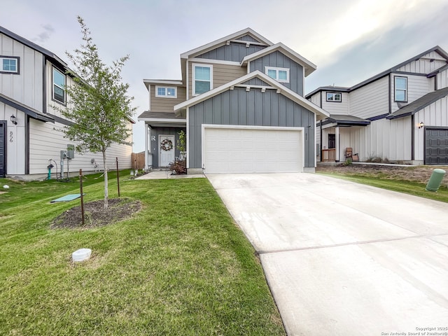 view of front facade with board and batten siding, a front yard, and concrete driveway