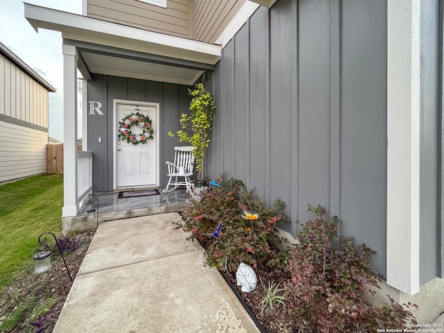 property entrance featuring board and batten siding