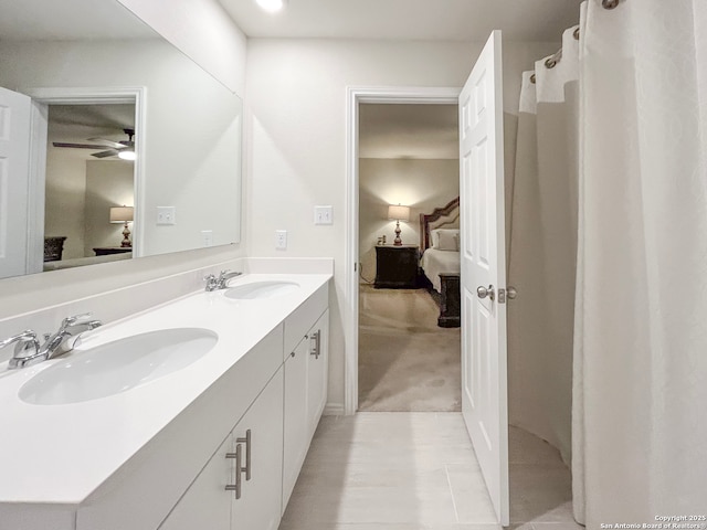 ensuite bathroom with ensuite bathroom, double vanity, and a sink