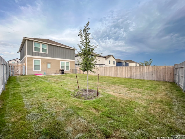 view of yard with a fenced backyard