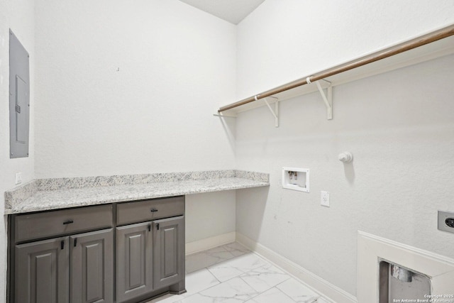 washroom featuring electric panel, baseboards, marble finish floor, hookup for a washing machine, and hookup for an electric dryer