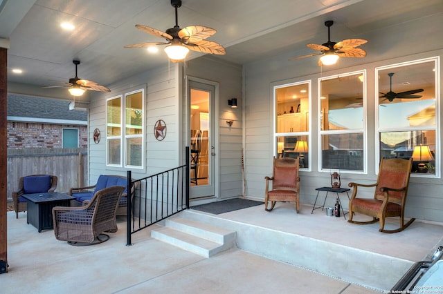 view of patio featuring fence and ceiling fan