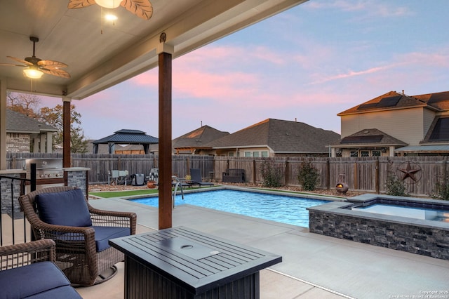 view of swimming pool with a fenced backyard, a grill, a gazebo, a patio area, and a pool with connected hot tub