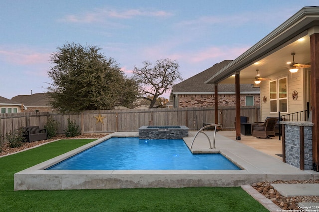 view of swimming pool featuring a fenced backyard, a ceiling fan, and a patio