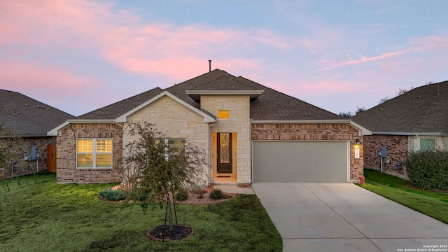 view of front facade featuring an attached garage, driveway, a shingled roof, and brick siding