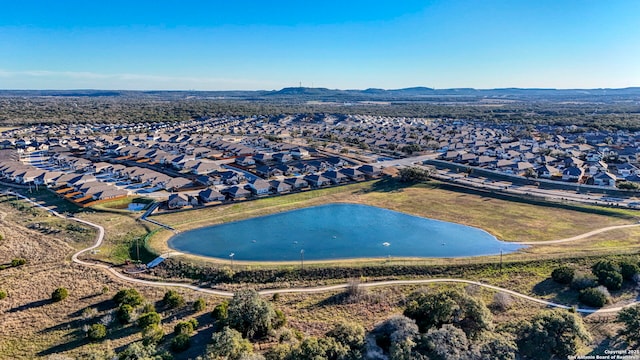 drone / aerial view featuring a water view and a residential view