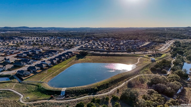 birds eye view of property with a water view and a residential view