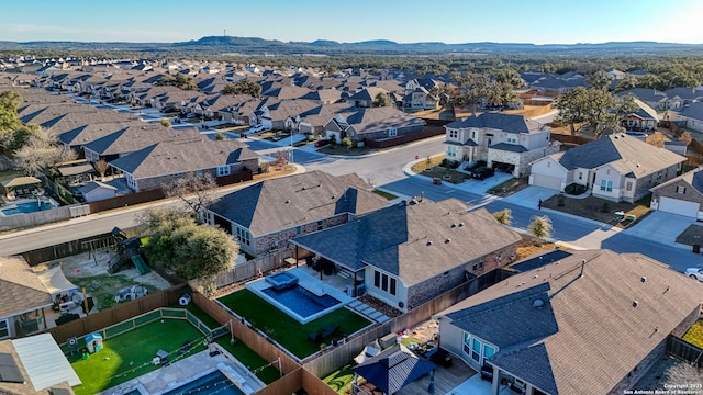 aerial view featuring a mountain view and a residential view