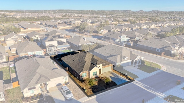 birds eye view of property featuring a mountain view and a residential view