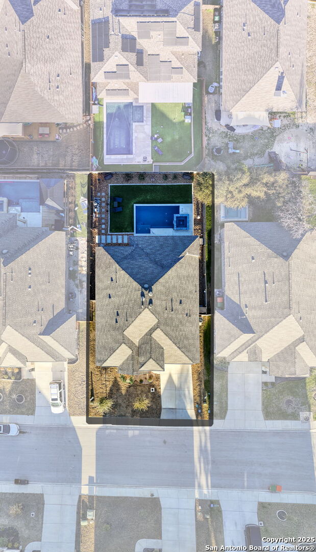 birds eye view of property with a residential view