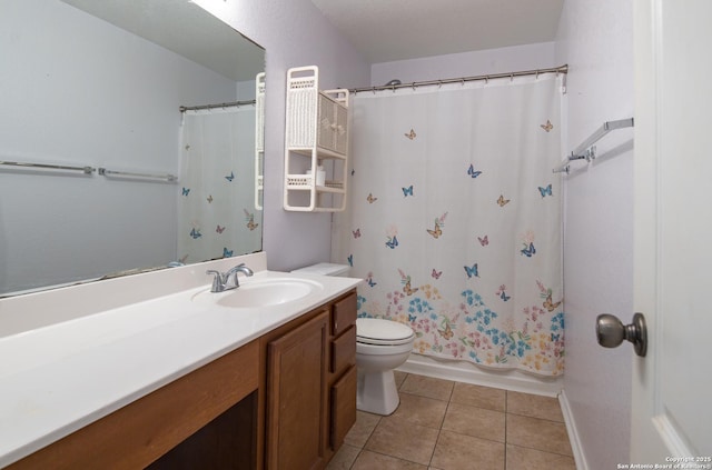 bathroom featuring shower / tub combo with curtain, vanity, toilet, and tile patterned floors