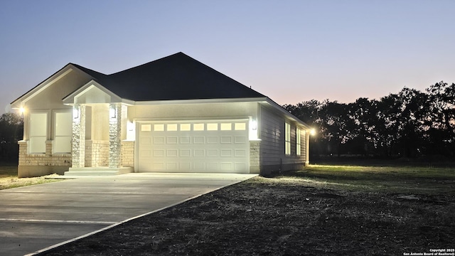 16107 Vaquero Dr, Atascosa, TX 78002 - view of front of home featuring an attached garage and driveway