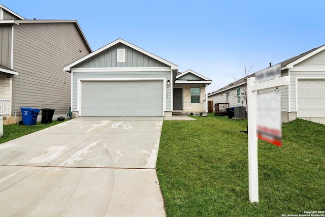 single story home with an attached garage, cooling unit, concrete driveway, a front lawn, and board and batten siding