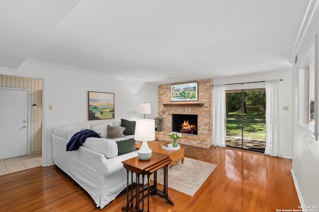 living area with a fireplace and wood finished floors