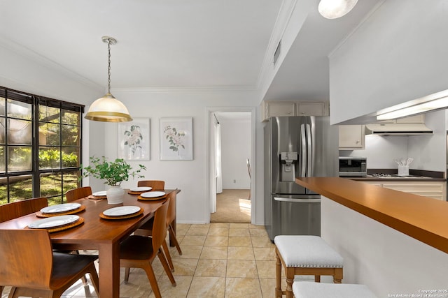 dining space with ornamental molding, visible vents, baseboards, and light tile patterned floors