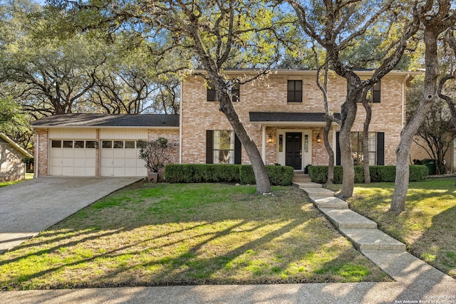 view of front of house featuring a garage, brick siding, concrete driveway, and a front yard